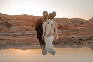 bride wearing Sequin boho wedding dress in the valley of fire by Shikoba Bride image by Marissa Rose Photography